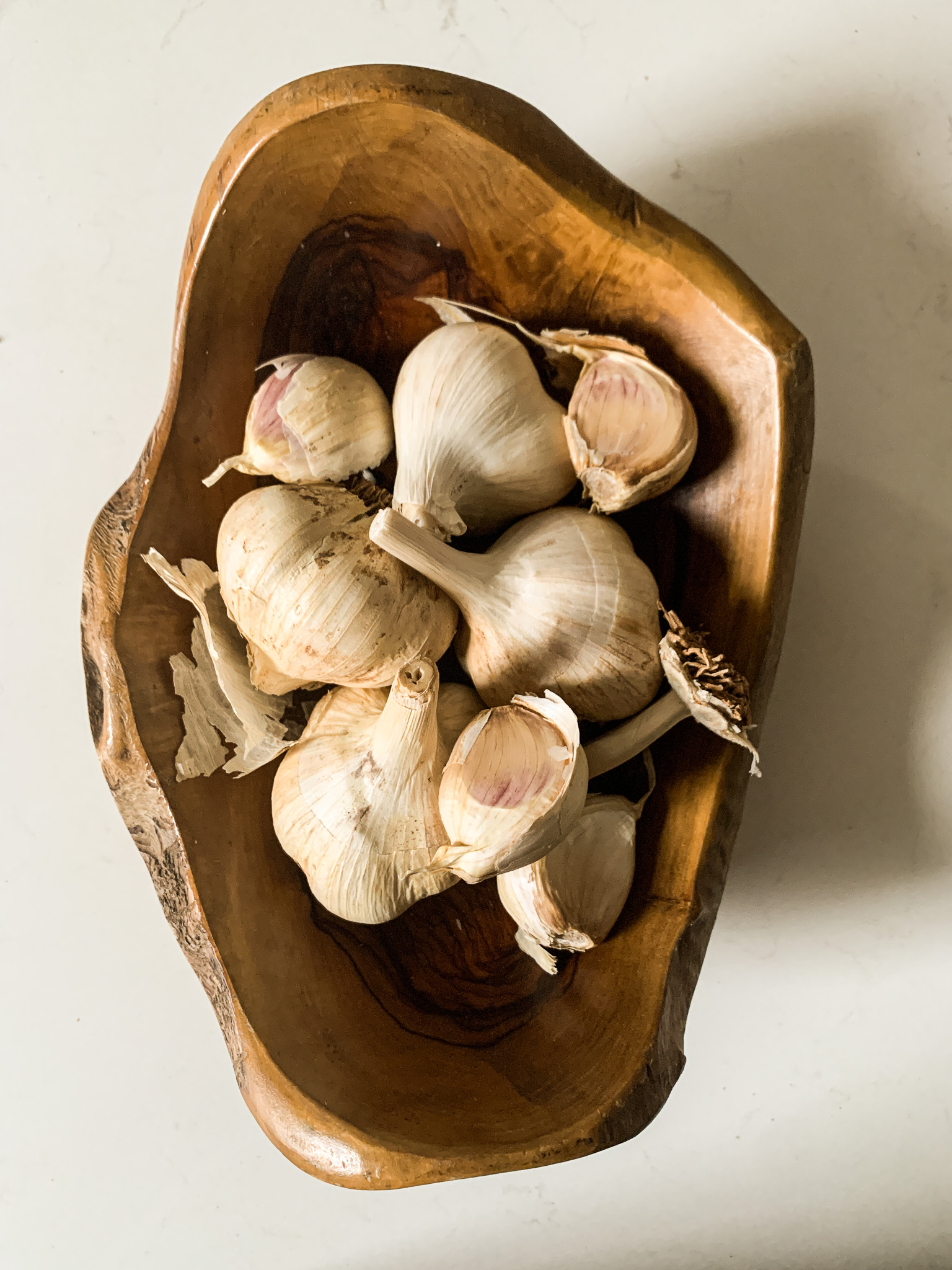olive wood bowl of garlic